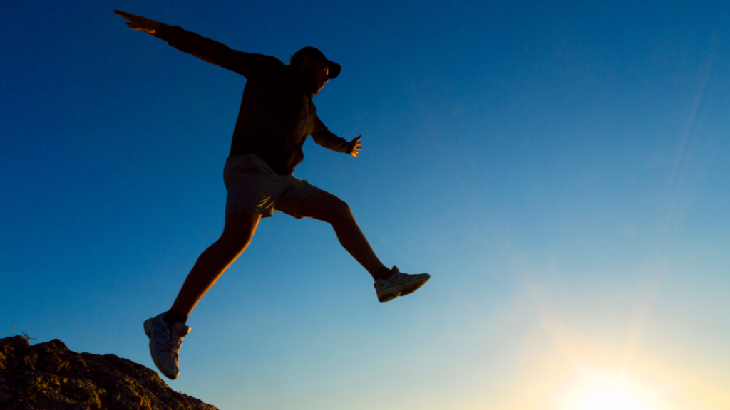 taking a leap across a chasm, representing taking risks (winning edge competitions, positive risk-taking, high achiever)